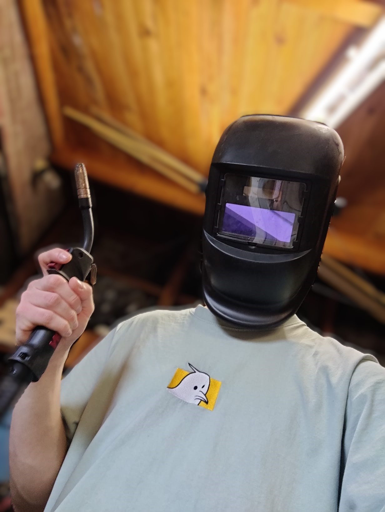 Working on a welding project in the shed